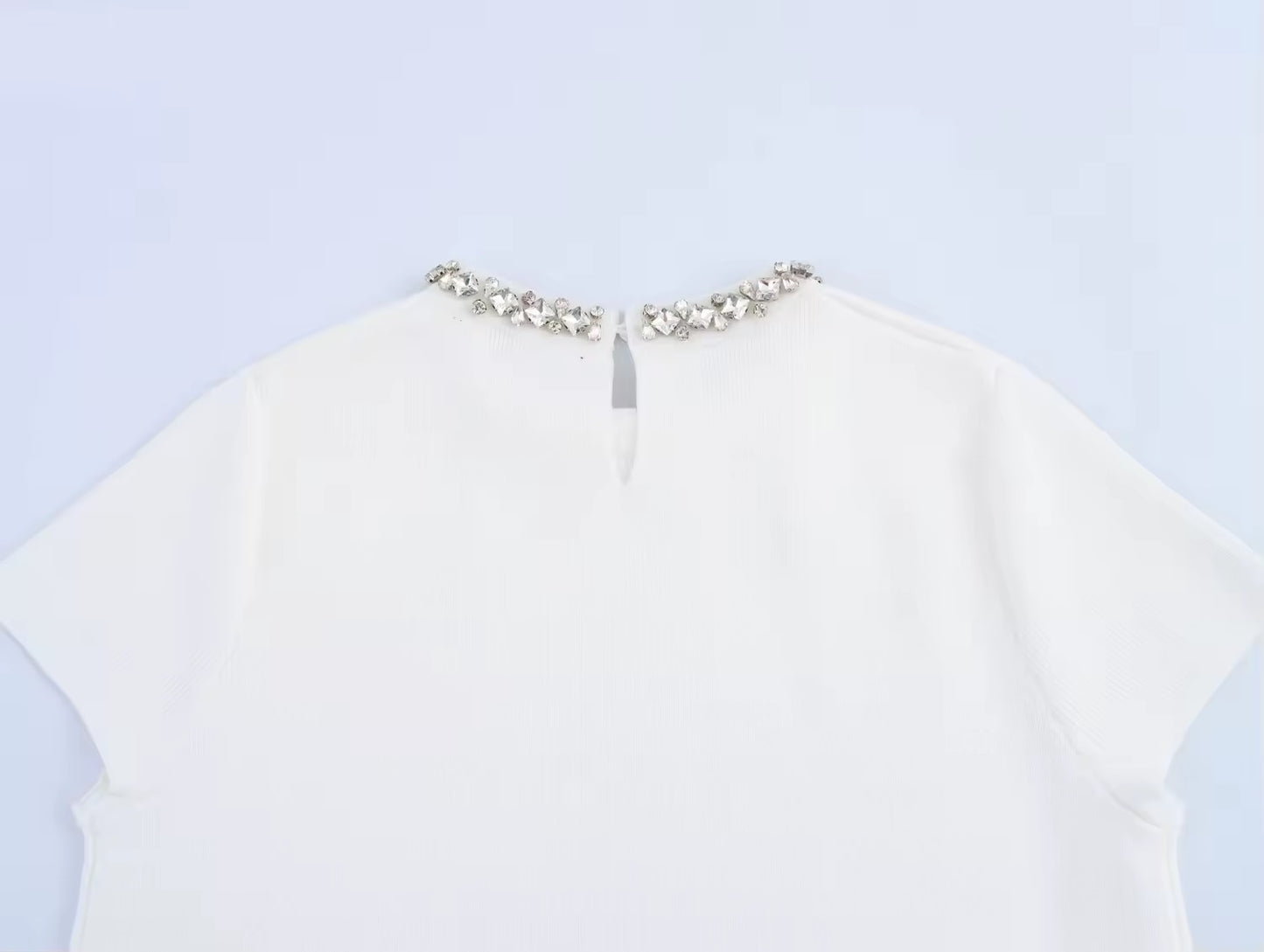 White mini dress with decorative trim