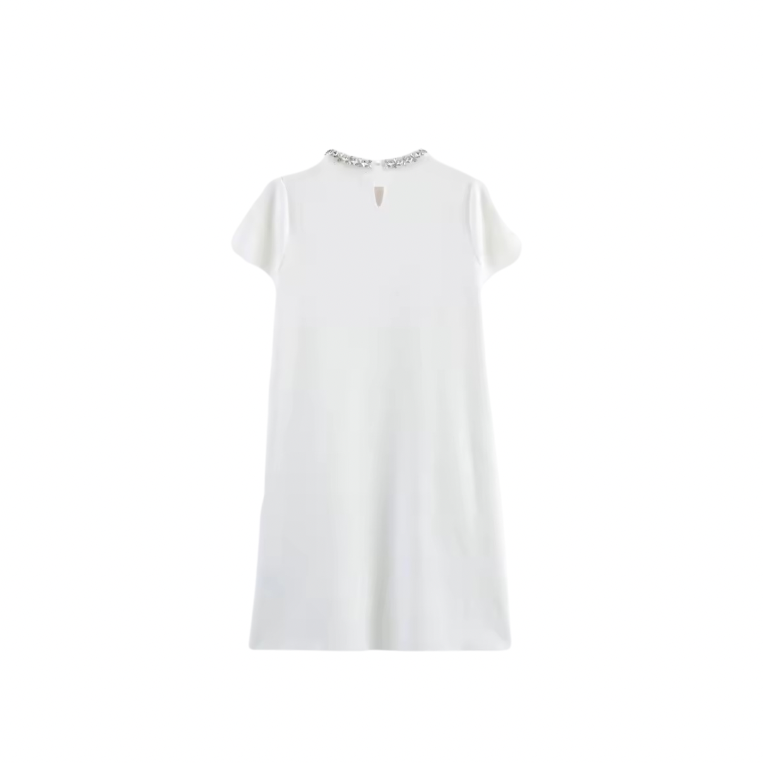 White mini dress with decorative trim