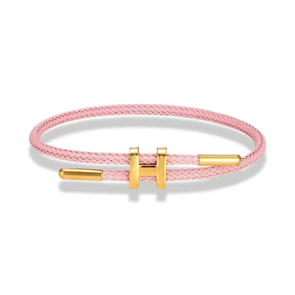 TwistMe verstellbares Damen Armband mit Charm aus rosa geflochtenem Seil und goldenen Metallakzenten