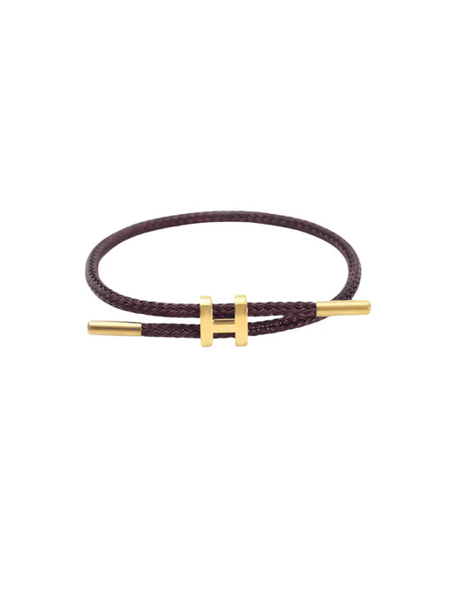TwistMe verstellbares Damen Armband mit Charm aus braun geflochtenem Seil und goldenen Metallakzenten